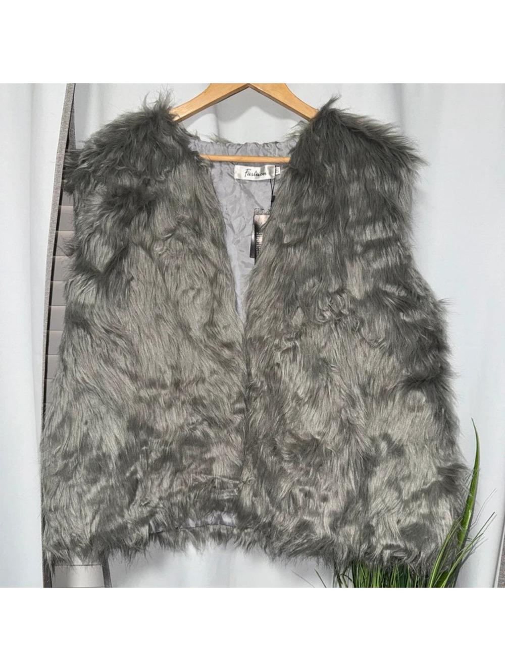 grey shaggy faux fur vest with a V-neckline